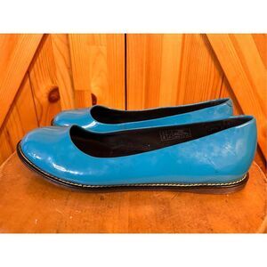 Dr. Martens Glossy Blue Flats